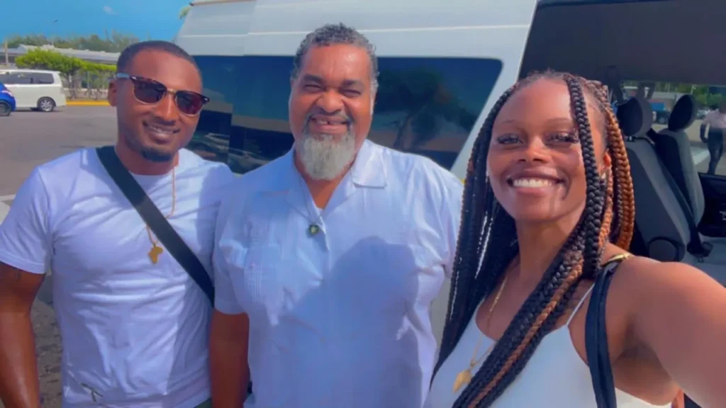 Hugh with two guests beside a TedTours van