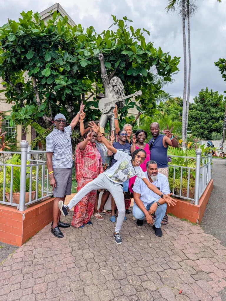 TedTours guests beside a Bob Marley statue