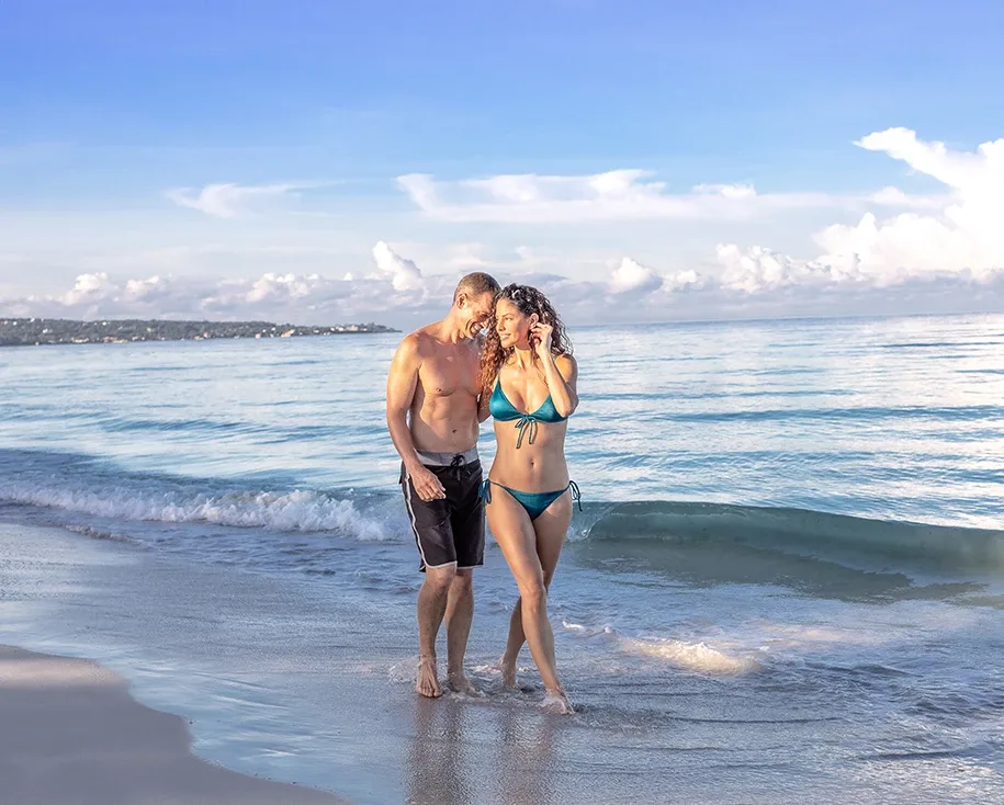 Couple standing in the sea at Couples Swept Away