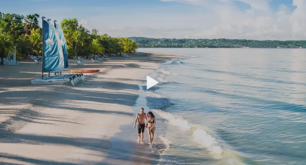 Lounge chairs beside the beach at Couples Swept Away